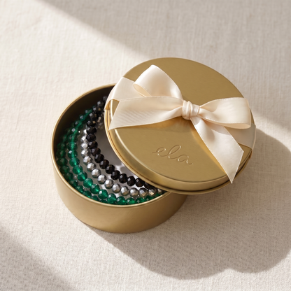 Cool Sparkle bundel als cadeau in gouden tin met cream satijnen strik